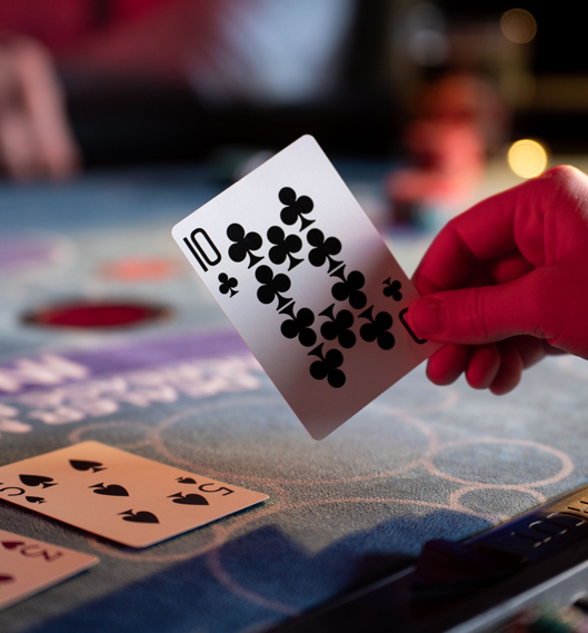 Player holding a card while playing a casino carnival game